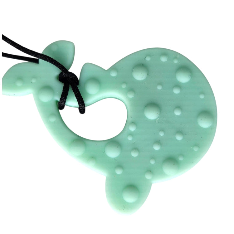 Mint green heart-shaped teething toy with black cord on a white background