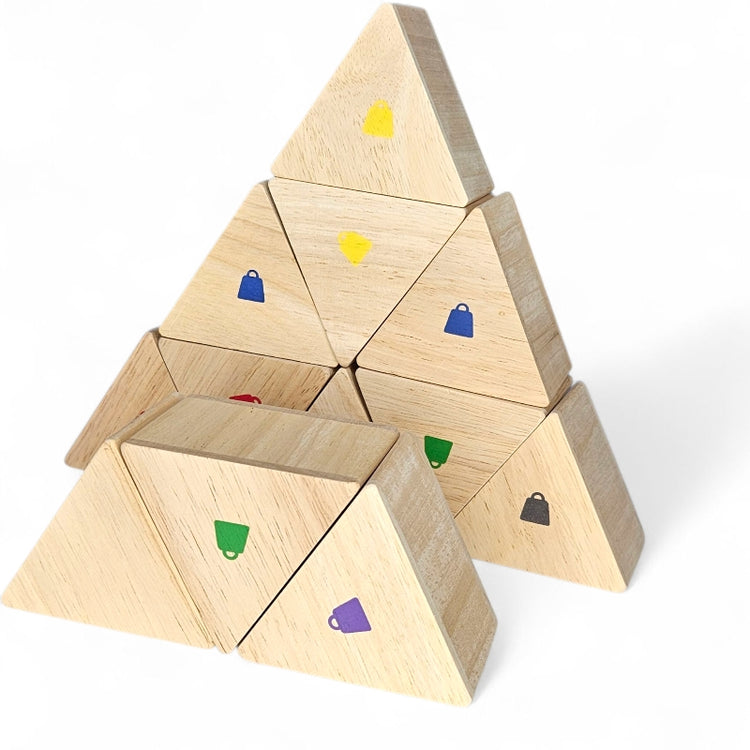 Wooden triangular pieces from the Kidpik Weight Memory Game stacked in a pyramid.