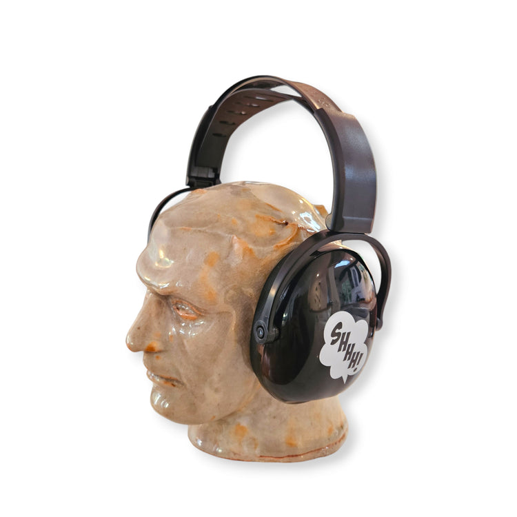 Black ear muffs designed for adults, displayed on a mannequin head.