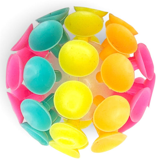A cluster of small, dome-shaped plastic suction cups in bright neon colors including yellow, orange, pink, and teal, arranged in a circular pattern on a white background.