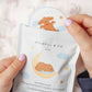 Hand holding a package of Mindful & Co Kids Moonlight Bodyatherapy Sleep Stickers with bear illustrations.