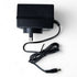 Black wall plug power adapter with coiled cable and barrel connector.