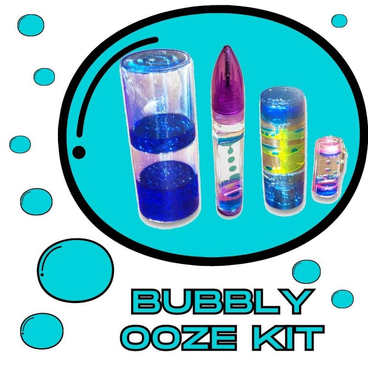 An assortment of items including a blue junior ooze tube, a liquid bubble pen, a spiral bubble timer, and a liquid key chain, all designed to create bubbles or oozing effects, displayed in front of a black calico Sensory Sam bag with the text &