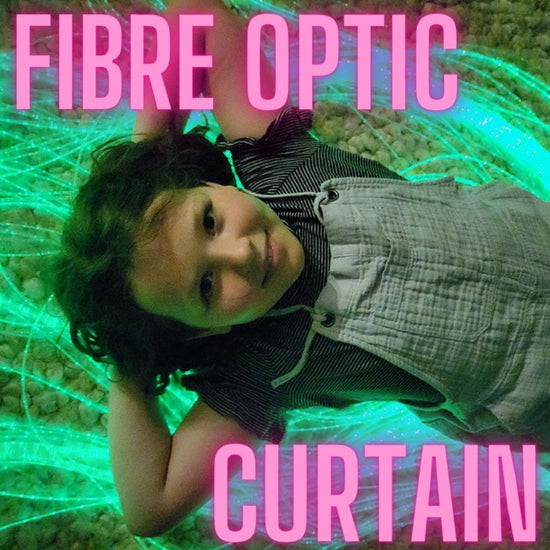 A child lying down with a fibre optic light curtain creating a network of lights around them, with the text &
