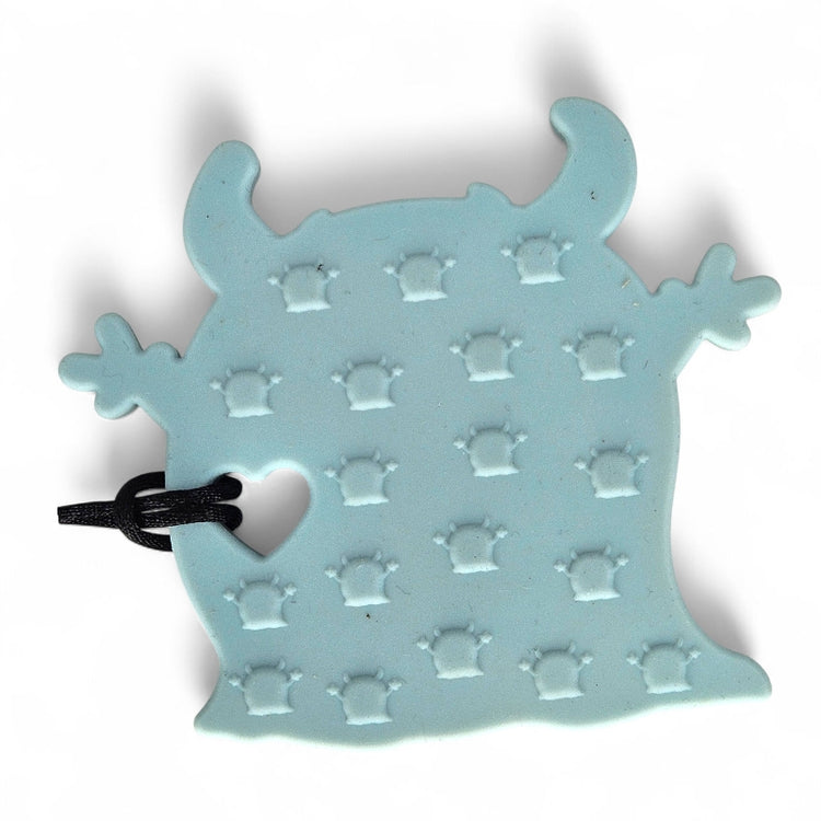 Light blue silicone mold with a black handle on a white background