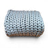 Blue knitted blanket on a white background