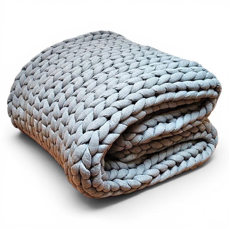 Folded blanket with a gradient of blue and gray on a white background