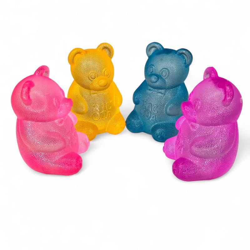 Four colorful bear-shaped objects on a white background