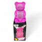 Pink gummy bear-shaped toy with packaging on a white background