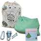 Sensory play kit with green bean bag, hardware, and instructions on a white background