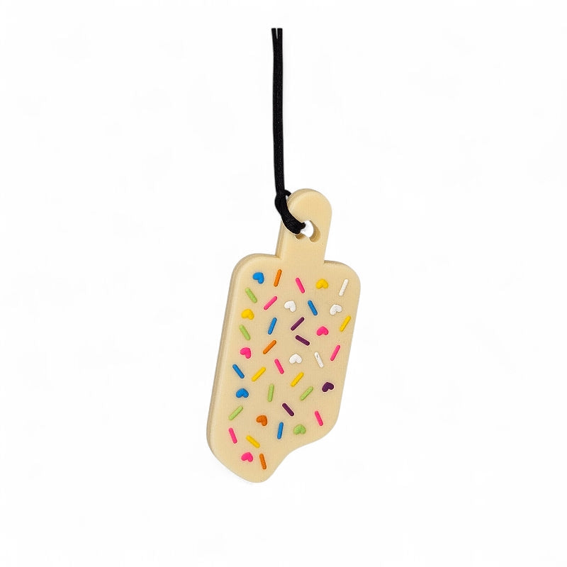 Wooden ice cream cone-shaped toy with colorful sprinkles on a white background