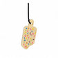 Wooden ice cream cone-shaped toy with colorful sprinkles on a white background