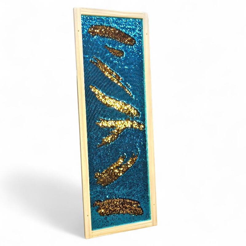 Decorative panel with gold sequin lightning bolts on a blue background