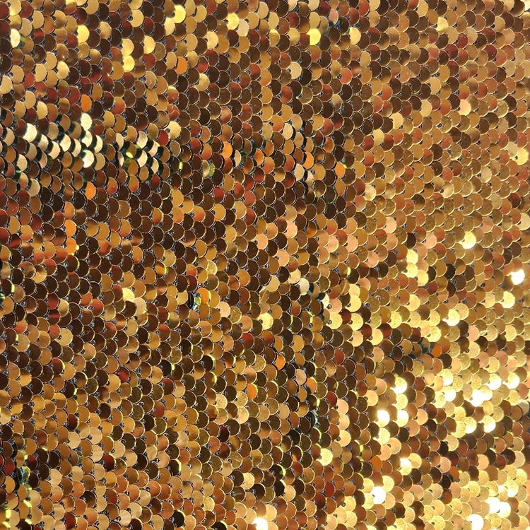 Close-up of a gold sequin fabric texture