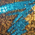 Close-up of blue and gold sequin fabric