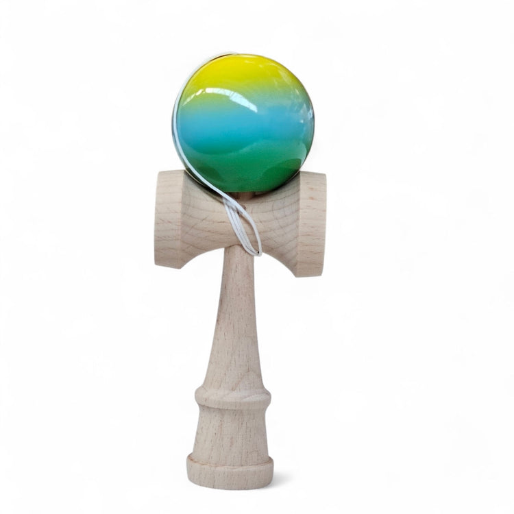 Wooden kendama with a colorful ball on a white background