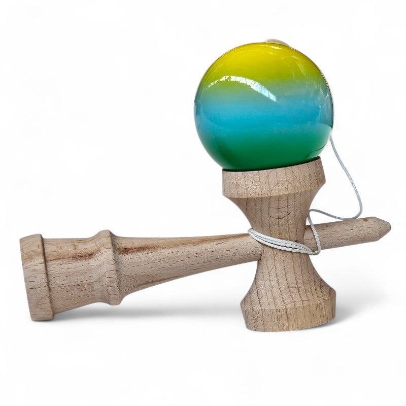 Wooden kendama with a colorful ball on a white background