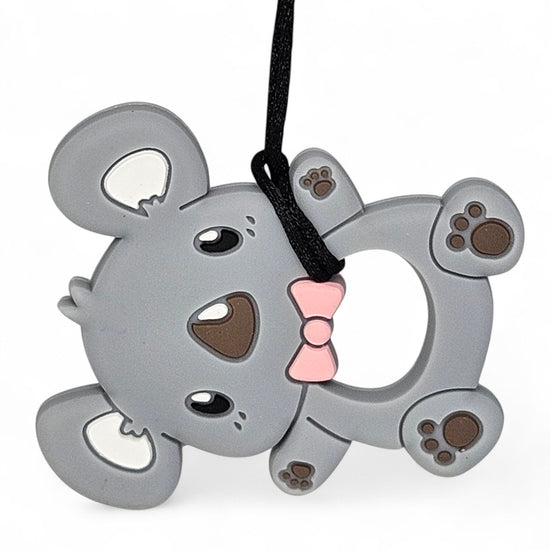 Gray mouse-shaped keychain with a pink bow on a white background
