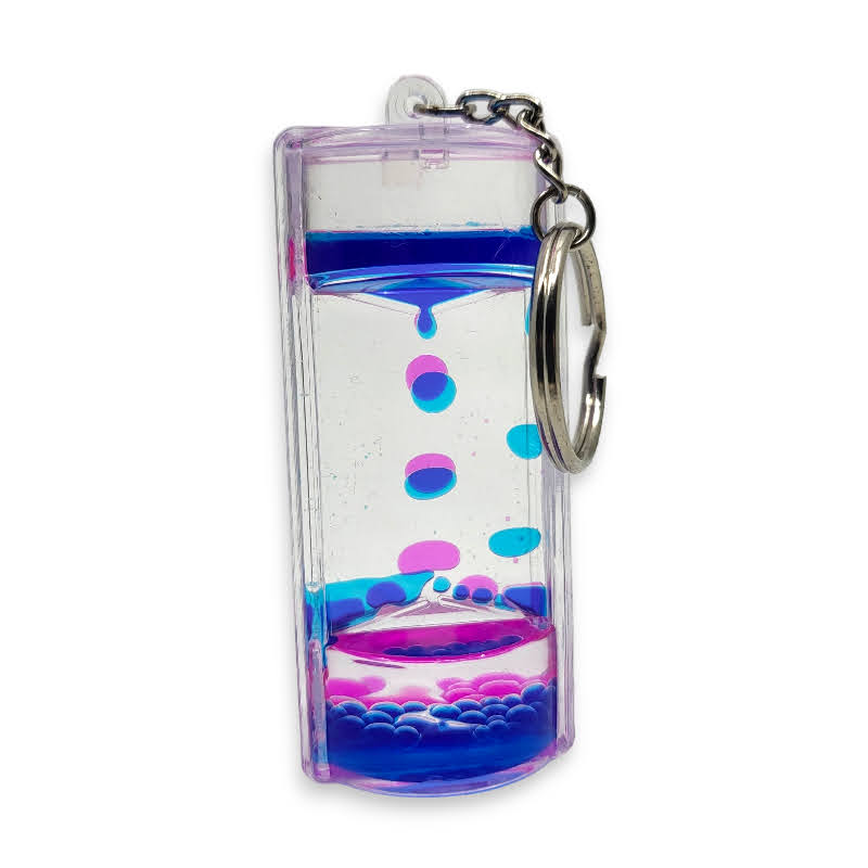A clear plastic keychain with a liquid bubble sensory design, featuring blue and purple liquids droplets.