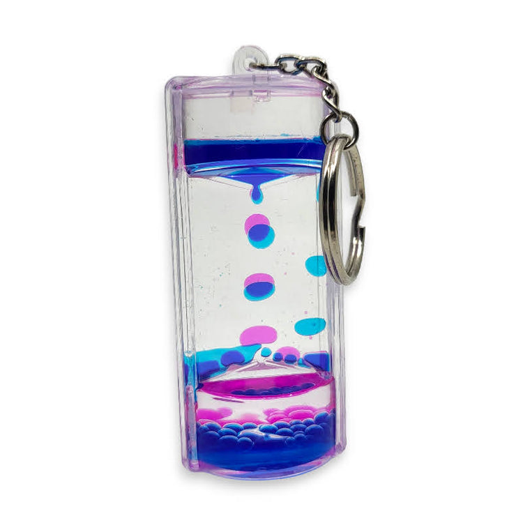 Keychain with a small liquid-filled container and colorful bubbles on a white background