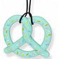 Light blue pretzel-shaped toy with colorful sprinkles on a white background