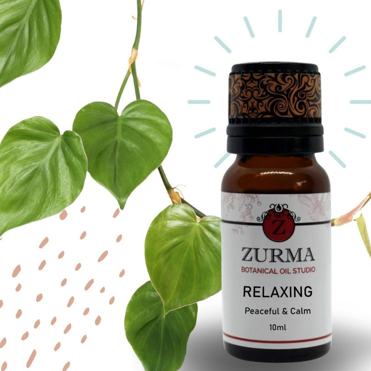 A brown bottle of Zurma essential oil blend labeled &
