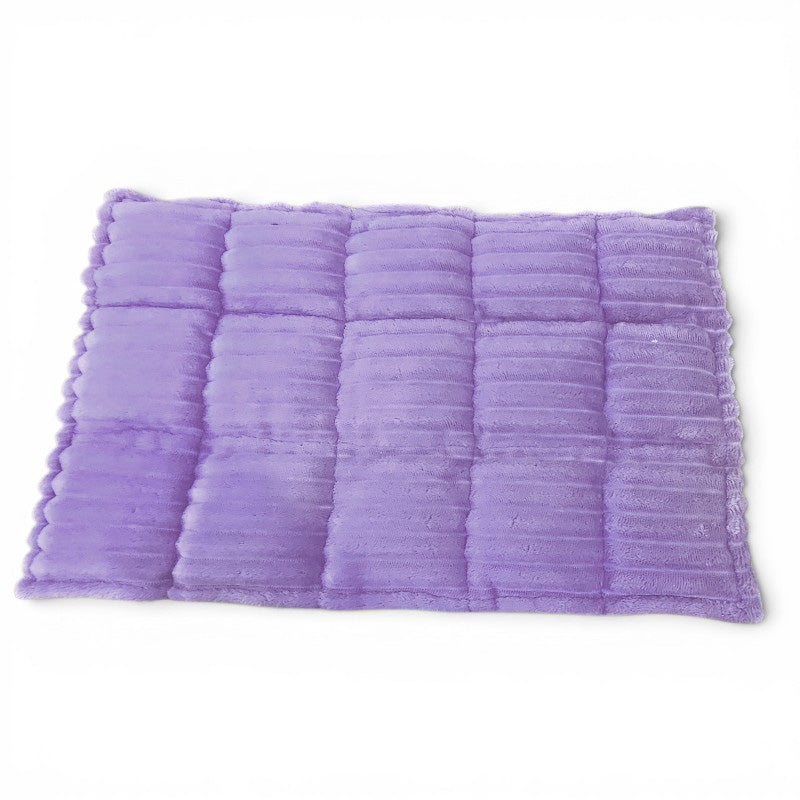 Purple textured bath mat on a white background