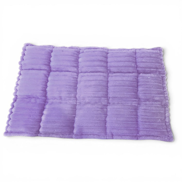 Purple textured bath mat on a white background
