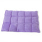 Purple textured bath mat on a white background