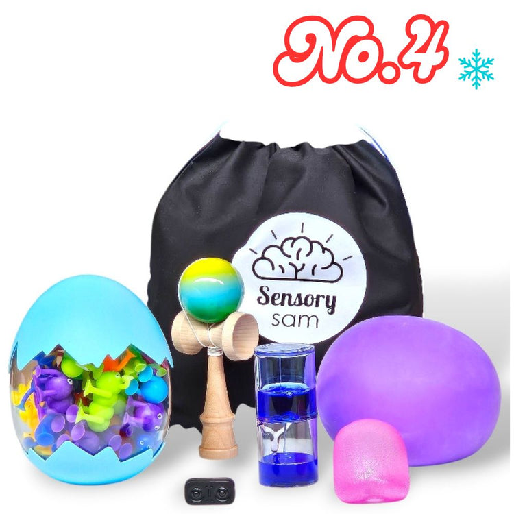 Assorted sensory toys including a colorful ball, a black drawstring bag with &