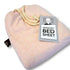 A pink sensory bed sheet made of cotton and spandex with a drawstring and a label showing the brand and product name.