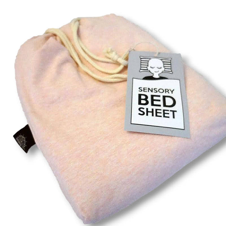 A pink sensory bed sheet made of cotton and spandex with a drawstring and a label showing the brand and product name.