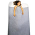 A grey sensory bed sheet made of cotton and spandex with a label attached showing the brand and product name.