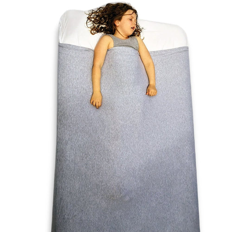 A grey sensory bed sheet made of cotton and spandex with a label attached showing the brand and product name.