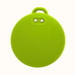 Green round silicone key cover with a keychain on a white background