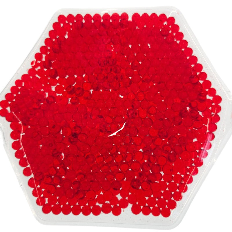 Red sequins inside a clear hexagonal gel shape on a white background.