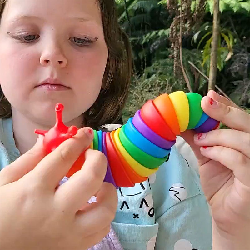 Child playing with a colorful toy in an outdoor setting