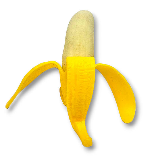 A yellow rubber squeezy banana toy with a peel-like stem.