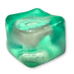 A hand squeezing a pink stress cube toy, which is designed to be squished and squeezed back to its original shape.