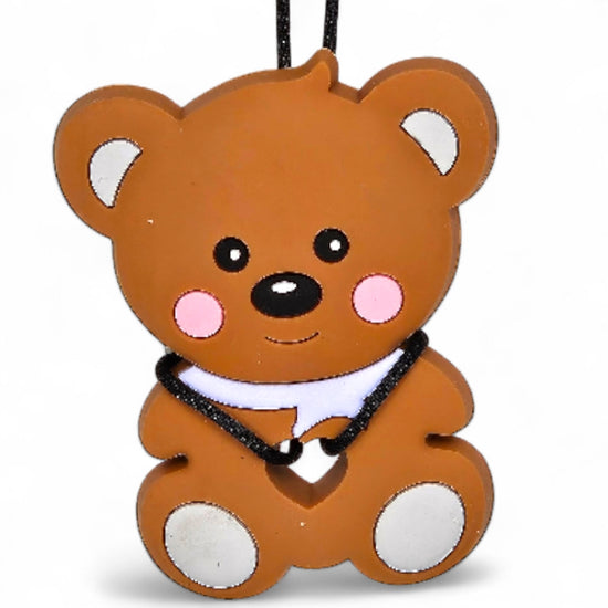 Brown teddy bear-shaped toy with a black collar on a white background