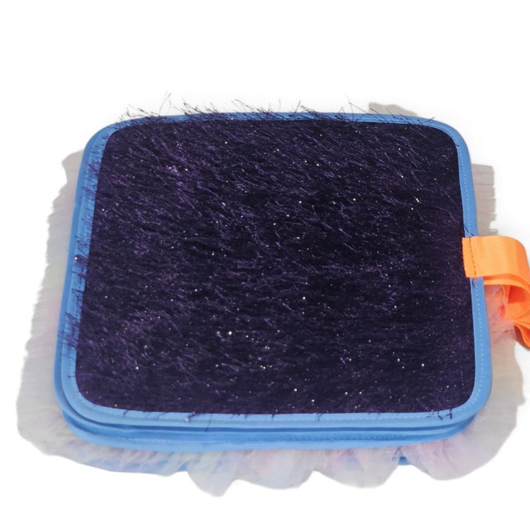Dark purple fuzzy textured page with blue edging and an orange tab from the Texture Discovery Book.