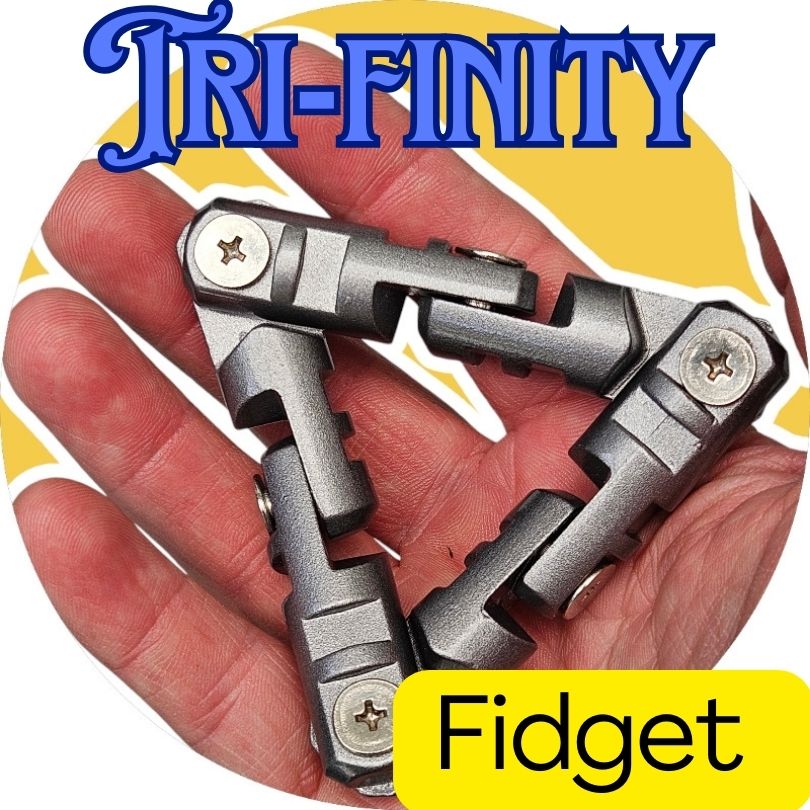 A triangular palm-sized silver fidget toy with visible screws on its folding mechanism, held in a person&