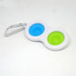 Keychain with blue and green silicone dots on a white background