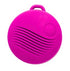 Front view of the pink round vibrating pendant with a loop at the top and textured ridges.