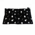 A black lap pad with a pattern of light bulb designs, laid flat.