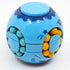 A blue and yellow burger-shaped fidget puzzle spinner with multiple layers of beads.