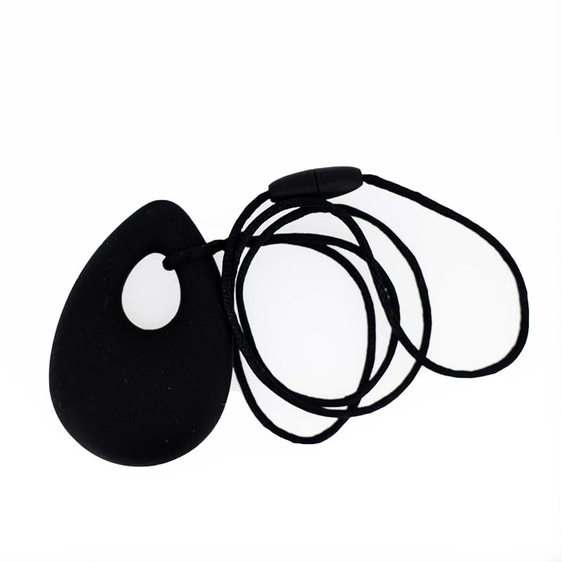 A black oval pendant chew necklace with a breakaway cord.