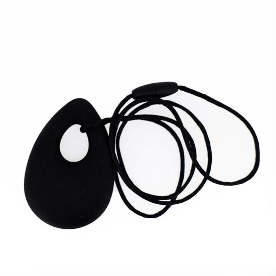 A black oval pendant chew necklace with a breakaway cord.