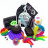 A collection of various fidget toys including a bubble pop DNA ball, a rainbow koosh ball, several stretchy stress strings, a push slider fidget, a rainbow snap pop fidget, a rad hands roller, a fidget puzzle ball, a mokuru roller, a white flippy fidget, and a fidget roller chain.
