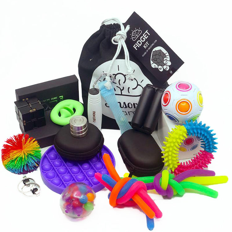 A collection of various fidget toys including a bubble pop DNA ball, a rainbow koosh ball, several stretchy stress strings, a push slider fidget, a rainbow snap pop fidget, a rad hands roller, a fidget puzzle ball, a mokuru roller, a white flippy fidget, and a fidget roller chain.